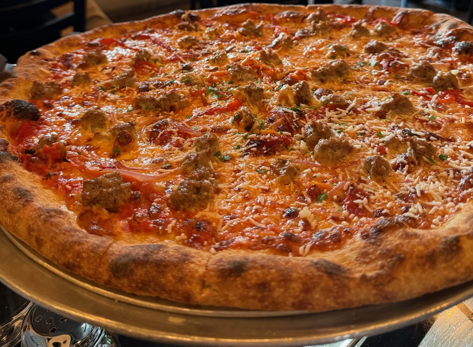 Close-up of a pizza with colorful toppings